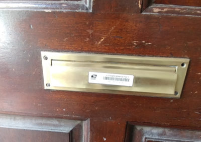 brass mail slot after metal restoration by Reese
